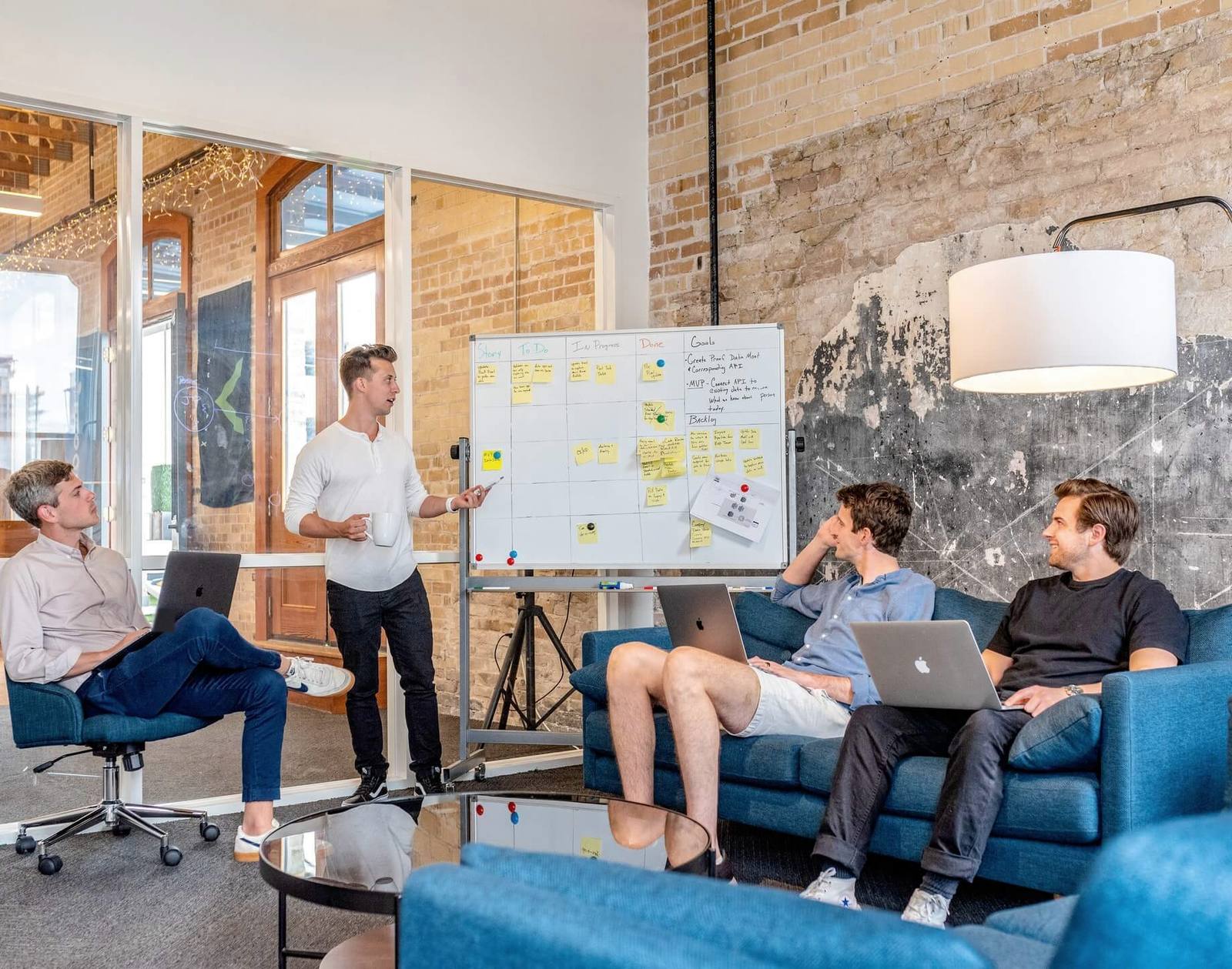 Founders discussing a product plan at a whiteboard